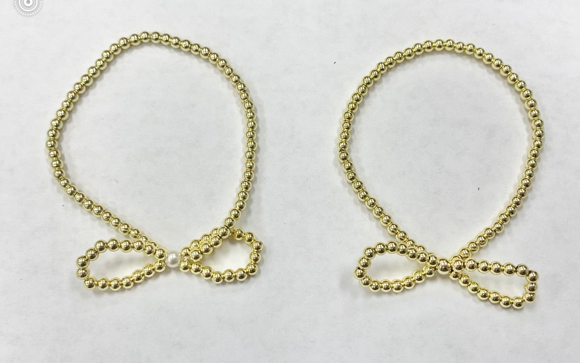 Gold beaded bracelet with bows
